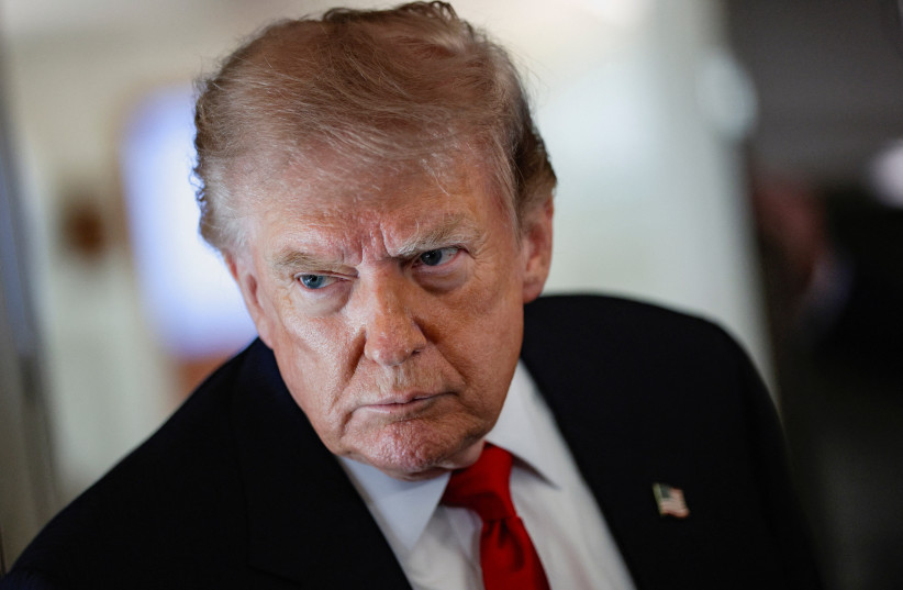 US President Donald Trump speaks to reporters aboard Air Force One en route to Michigan, US, July 27, 2026.
