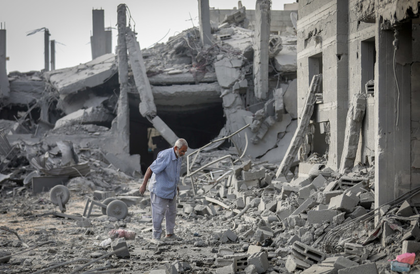 Palestinians inspect the damage caused by an Israeli airstrike that targeted a house belonging to the al-Qalqili family in al-Bureij refugee camp, central Gaza Strip, on July 30, 2026.