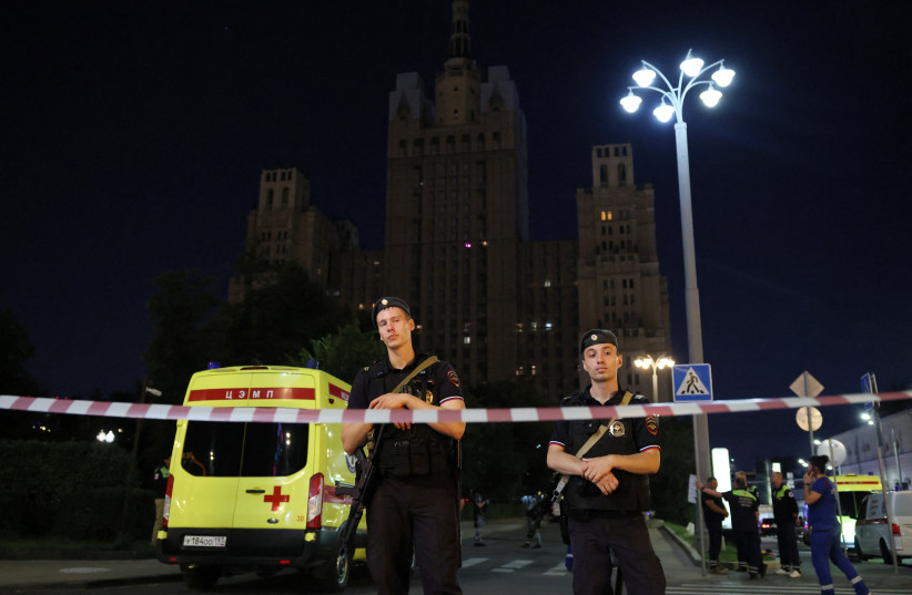 Police officers stand guard at the site of an explosion at a restaurant in central Moscow, Russia August 1, 2026.