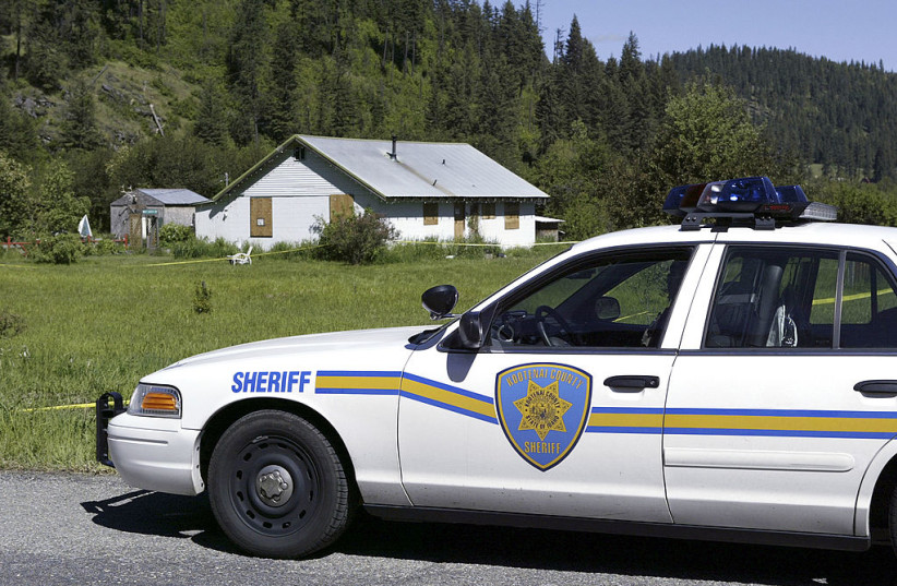Illustrative: A Kootenai County Sheriff deputy watches over the home of Brenda K. Groene May 25, 2005 north of Coeur D' Alene, Idaho.