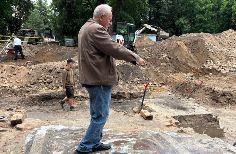 Jon Seligman, the archaeologist leading the excavation of the Great Synagogue, stands on the bimah of what had been, before its destruction by the Nazis and Soviets, one of the most important religious, cultural and intellectual hubs for Lithuanian Jews. (Shira Li Bartov)