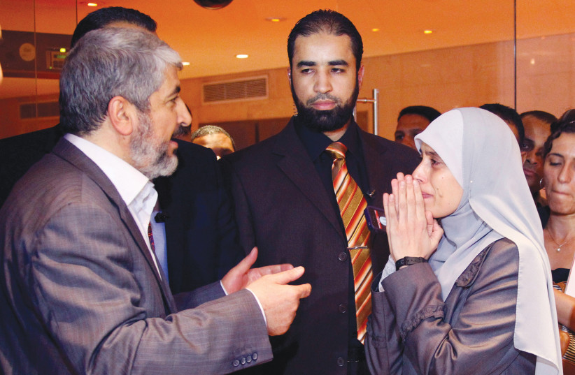 Sbarro terrorist Ahlam Tamimi greeted by Hamas leader Khaled Meshaal upon her ''triumphant'' arrival in Cairo, Oct. 2011.