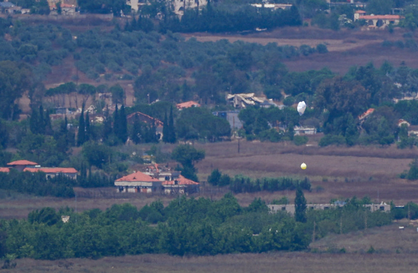 A balloon suspended beneath a parachute over southern Lebanon opposite Metula, near the Lebanon-Israel border. July 22, 2026.  (credit: AYAL MARGOLIN/FLASH90)