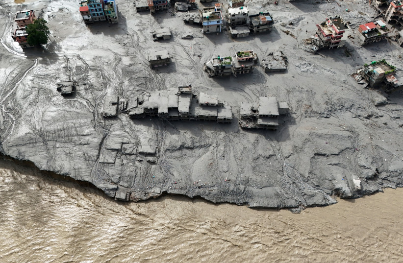 A drone view shows mud covering buildings and property following devastating floods at Trishuli in Nuwakot district, Nepal, August 27, 2026.
