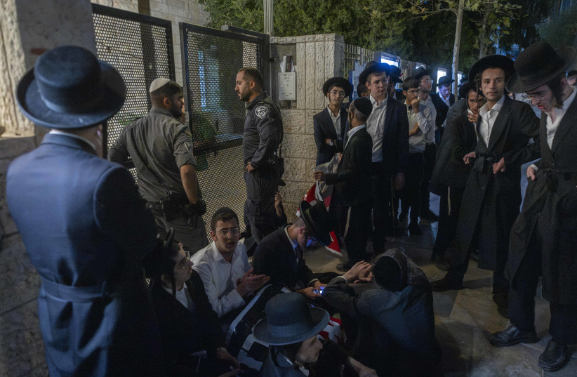 Ultra-Orthodox Jewish protesters demonstrate against an IDF recruitment conference for the Haredi community in Jerusalem, August 4, 2026.