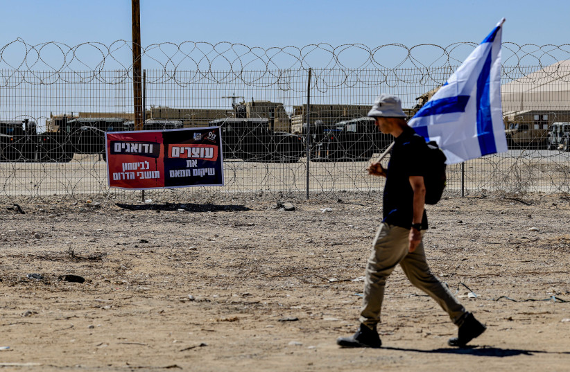 Activists block trucks carrying humanitarian aid to the Gaza Strip at the Kerem Shalom crossing, near the Israeli border with Gaza, August 25, 2026