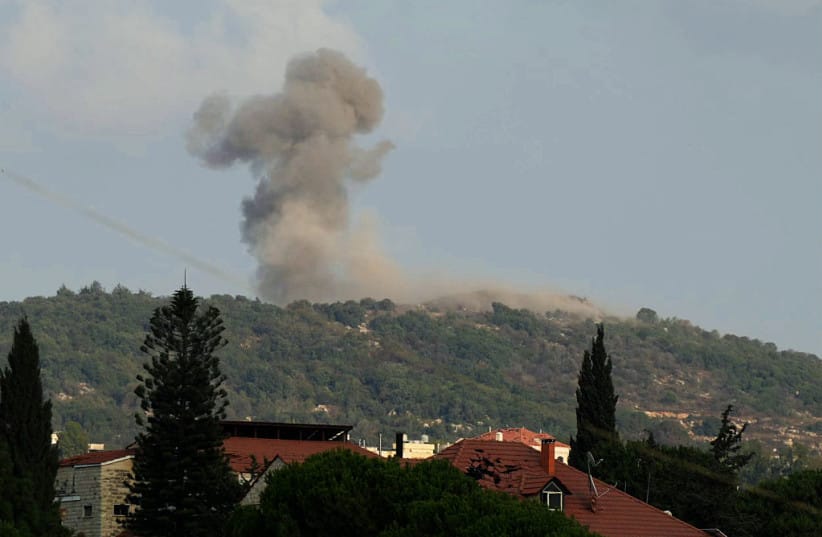 A photograph taken from the southern Lebanese area of Nabatieh shows smoke as it rises from the site of Israeli strikes that targeted the hilltops of the mountainous area of the strategic Ali al-Taher Ridge on August 14, 2026.