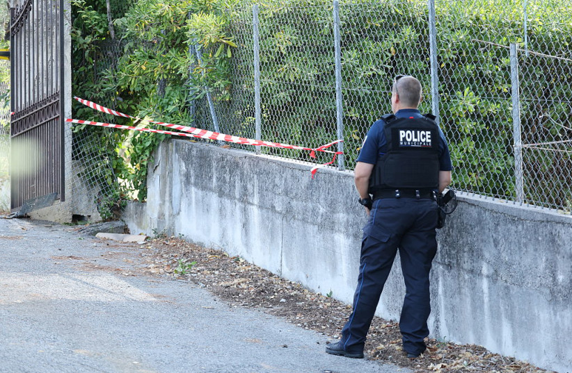A police officer stands near a hole cut by the thieves in the outer fence of the Musee Renoir after four paintings, together valued at nine million euros, were stolen in an early-morning break-in, with two recovered in the museum's garden and two still missing, in Cagnes-sur-Mer on September 8, 2026