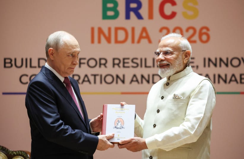 Russian President Vladimir Putin receives a Russian-language edition of Thirukkural ancient collection of couplets from Indian Prime Minister Narendra Modi during their meeting on the sidelines of the BRICS summit in New Delhi, India, September 11, 2026.