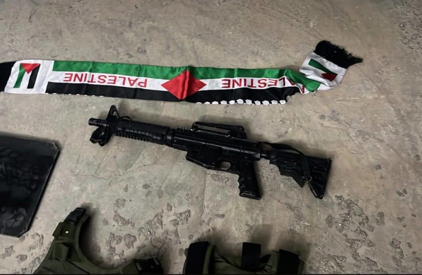 An m-16 rifle, a palestinian flag, combat vests, and what appears to be body armor seized by the IDF in the West Bank raid on September 15, 2026.