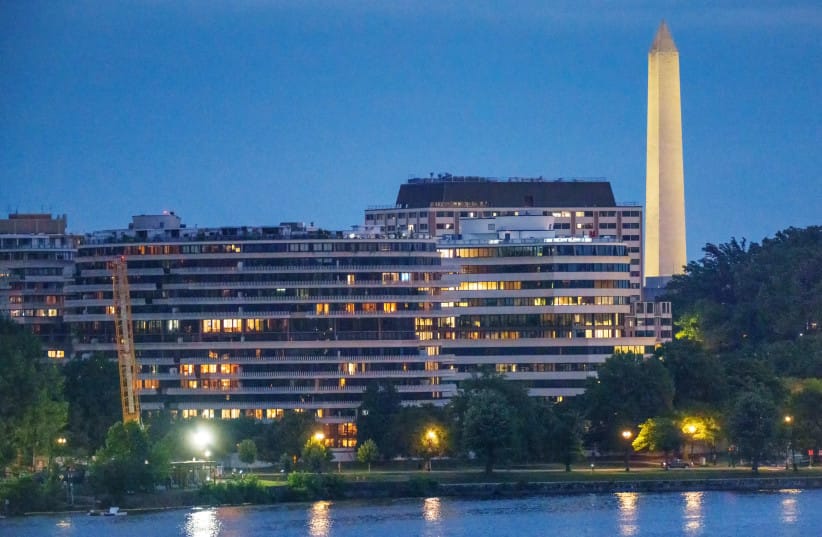The Watergate Complex is seen at twilight with the Washington Monument in the background on July 29, 2026, in Washington, DC.