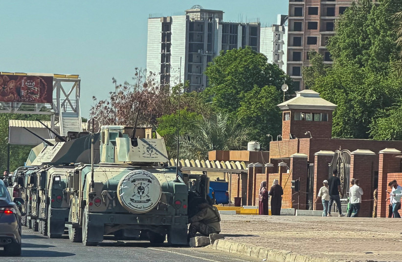 Iraqi security forces vehicles parked outside a court building, where six French nationals accused of belonging to Islamic State are standing trial, in Baghdad, Iraq, September 20, 2026.