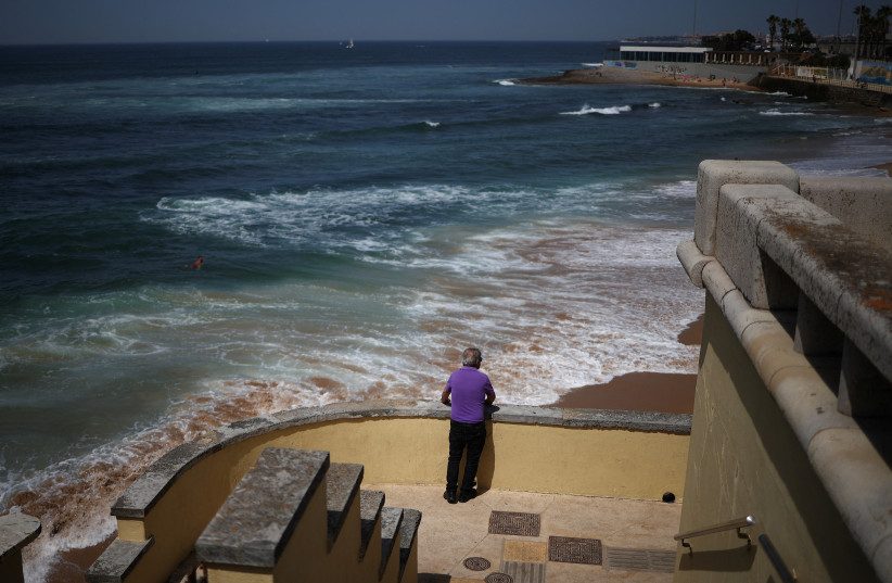 A person looks on at Parede beach, as hot temperatures hit Cascais Tuesday, 26th May 2026
