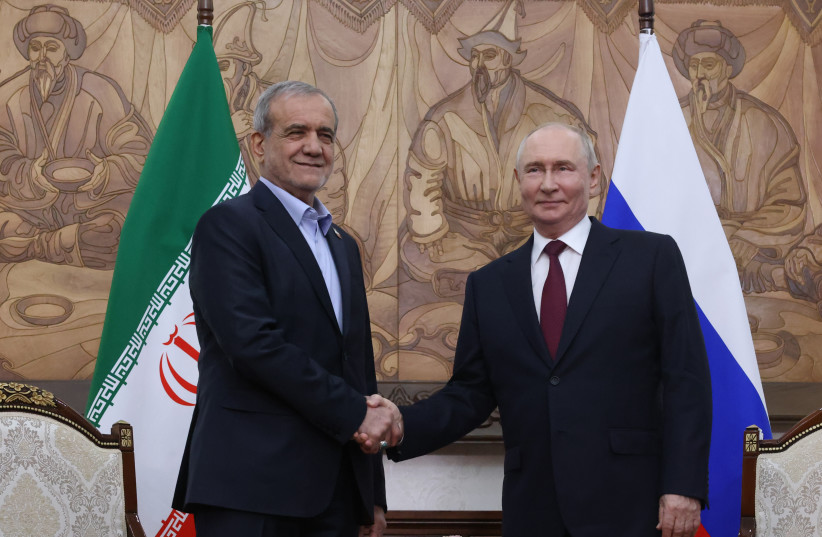: Russian President Vladimir Putin (R) shakes hands with Iranian President Masoud Pezeshkian (L) during their bilateral meeting on September 1, 2026 in Bishkek, Kyrgyzstan. Putin arrived to Kyrgyzstan with a two-days trip to attend the Shanghai Cooperation Organization (SCO) Summit. (Illustrative)