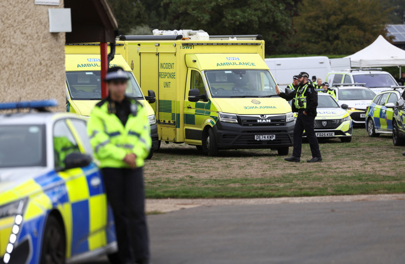 Emergency vehicles are parked at Fairford Youth Football club, near RAF Fairford, which hosts US Air Force personnel, in Fairford, Gloucestershire, Britain, September 27, 2026. Police declared a major incident at UK's Fairford air base after several men were arrested on suspicion of offences under t