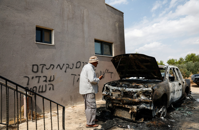 A Palestinian man inspects a vehicle damaged in what Palestinians say was an settler attack, in Deir Abu Masha'al, near Ramallah, in the West Bank, September 28, 2026