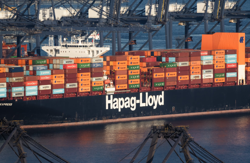 A Hapag-Lloyd container ship carrying stacks of shipping containers is berthed beneath quay cranes at Yantian Port on September 26, 2026, in Shenzhen, Guangdong Province, China.