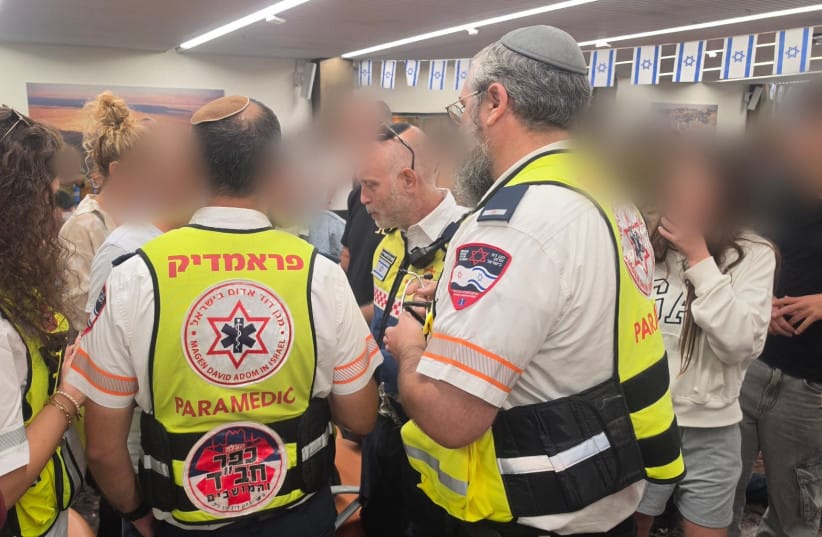 Paramedics examine a 51-year-old male passenger from flydubai flight FZ1073 following his arrival in Israel on a rescue flight after an attempted hijacking, September 30, 2026.