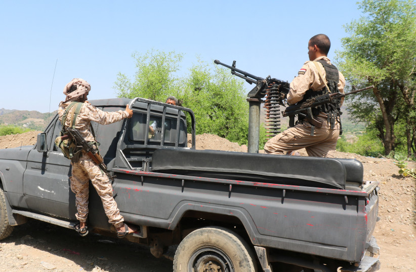 Members of the Saudi-backed Yemeni government forces ride on a military pick-up vehicle as they patrol a road leading to a frontline of clashes with Iran-aligned Houthi fighters, in Taiz province, Yemen, September 30, 2026.