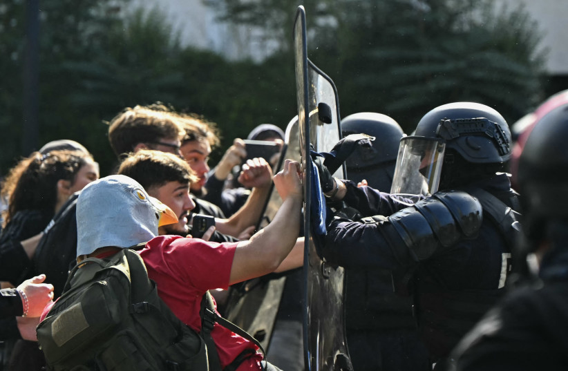 Anti-riot police officers face protesting students carrying out blockading action outside the secondary school Le Corbusier, in Aubervilliers, northern Paris on October 1, 2026.