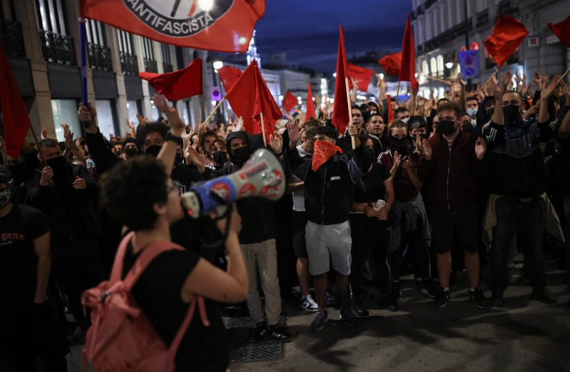 People take part in a protest against fascism and the housing crisis in Puerta del Sol square, where a camp has been set up, demanding political action to stop evictions and address the housing crisis, following the eviction of an 87-year-old woman from her home, in Madrid, Spain, October 3, 2026.