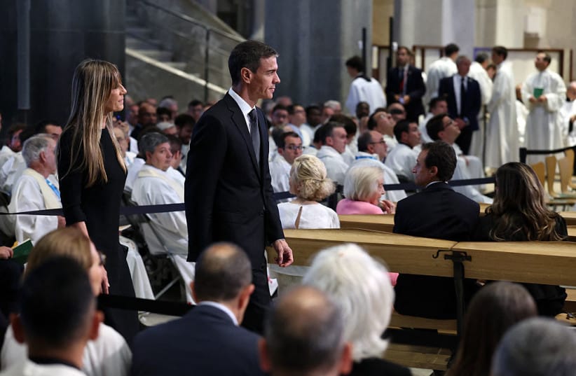 Spanish Prime Minister Pedro Sanchez and his wife Begona Gomez (L) arrive to attend a Holy Mass to be led by Pope Leo XIV in the Basilica of the Sagrada Familia and the inauguration of the Jesus Christ tower in Barcelona, on June 10, 2026.