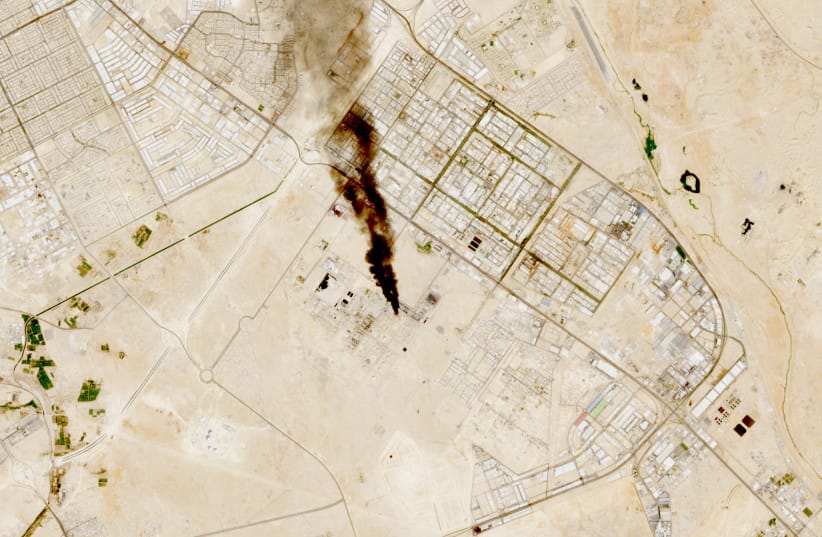 Smoke rises from the site of the Saudi Aramco refinery after reported Houthi attacks, south of Riyadh, Saudi Arabia, in this handout satellite image taken on October 3, 2026.