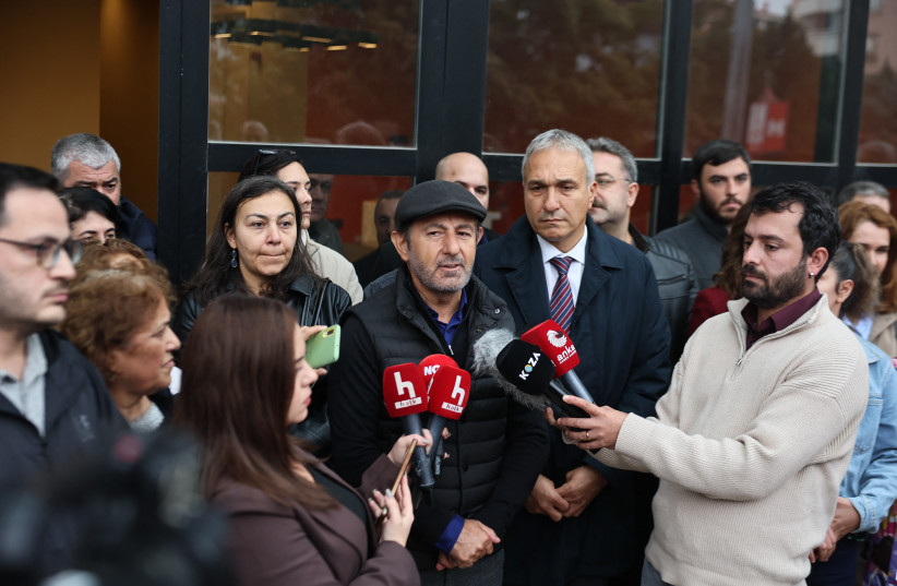 Serhan Asker, General Programme Coordinator at Halk TV, makes a statement outside the headquarters of Halk TV after it was raided by Police, halting broadcasts in the latest move against pro-opposition media, in Ankara on October 14, 2026.