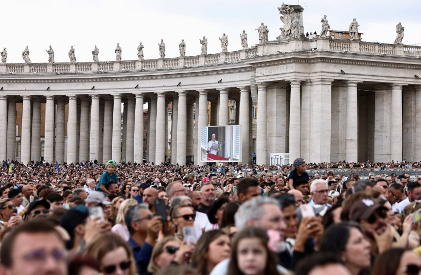 Faithful gather in St. Peter's Square as Pope Leo leads the Angelus prayer from a window of the Apostolic Palace, following his discharge from hospital after surgery for lung cancer, at the Vatican, October 18, 2026.