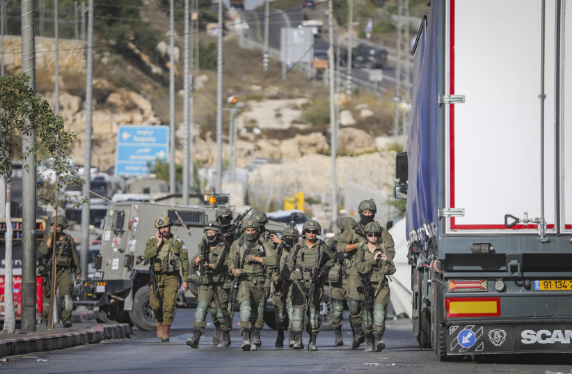 Israeli security forces near the scene of a shooting attack near the West Bank city of Hebron, October 23, 2026.