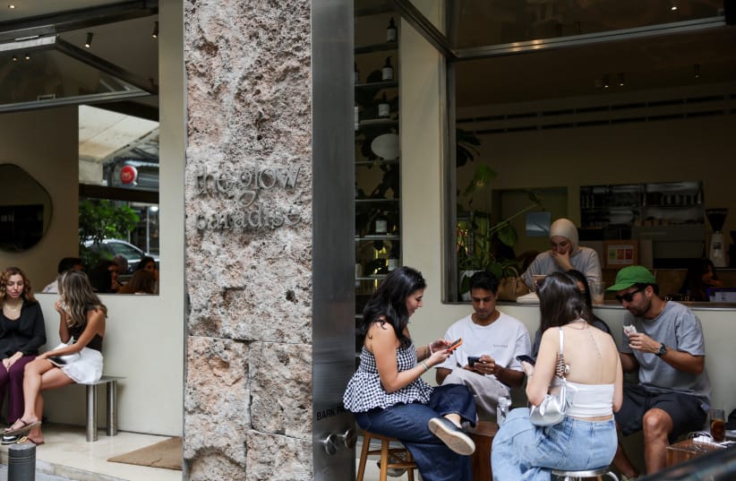 People sit outside the Glow Paradise restaurant in Beirut, Lebanon, October 16, 2026.