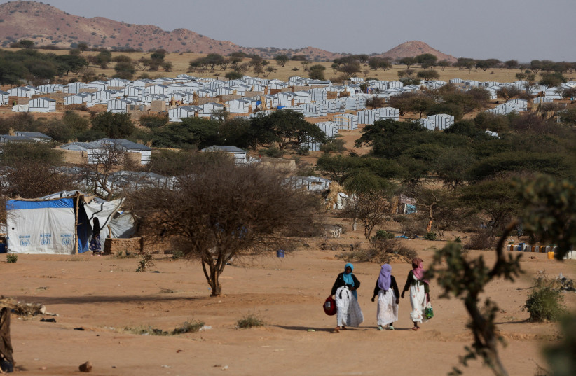 Sudanese refugees walk at the Iridimi refugee camp, northwest of Iriba, in Wadi Fira province, eastern Chad, November 27, 2025.