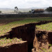  A tanker drives near a chasm suspected to have been caused by a heavy downpour along an underground fault-line near the Rift Valley town of Mai-Mahiu.
