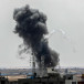  Smoke rises above buildings After air strikes by Israeli warplanes, in the southern Gaza Strip, on May 12, 2023. 
