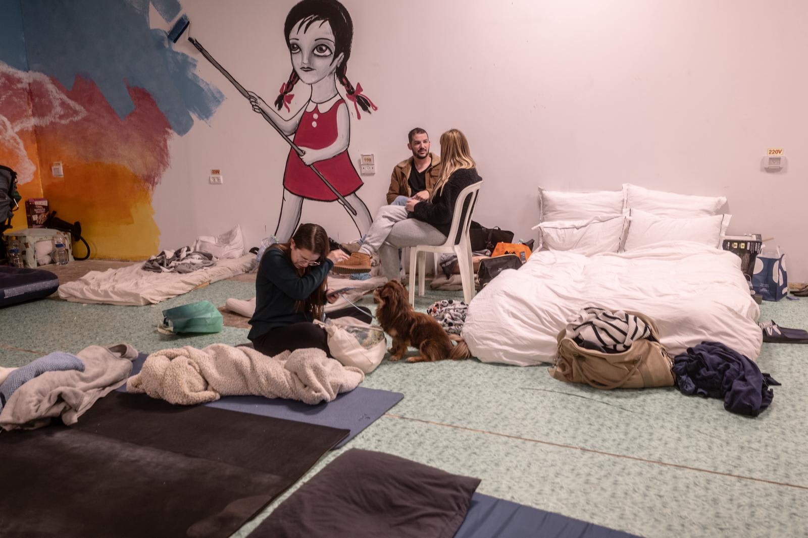 People gather in a public shelter in Tel Aviv amid rocket fire from Tel Aviv.  (photo credit: Chen Shimmel)