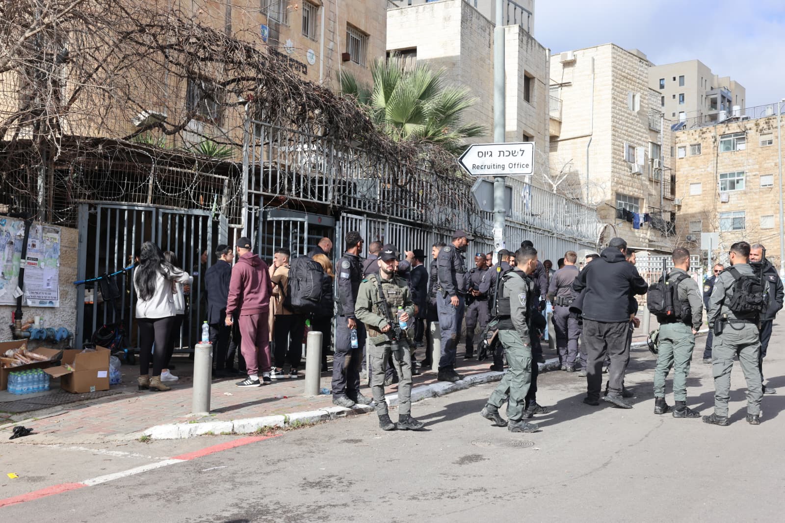 IDF GUARDS outside the recruitment center in Jerusalem as haredim protest the draft, February 4, 2026. (photo credit: MARC ISRAEL SELLEM)