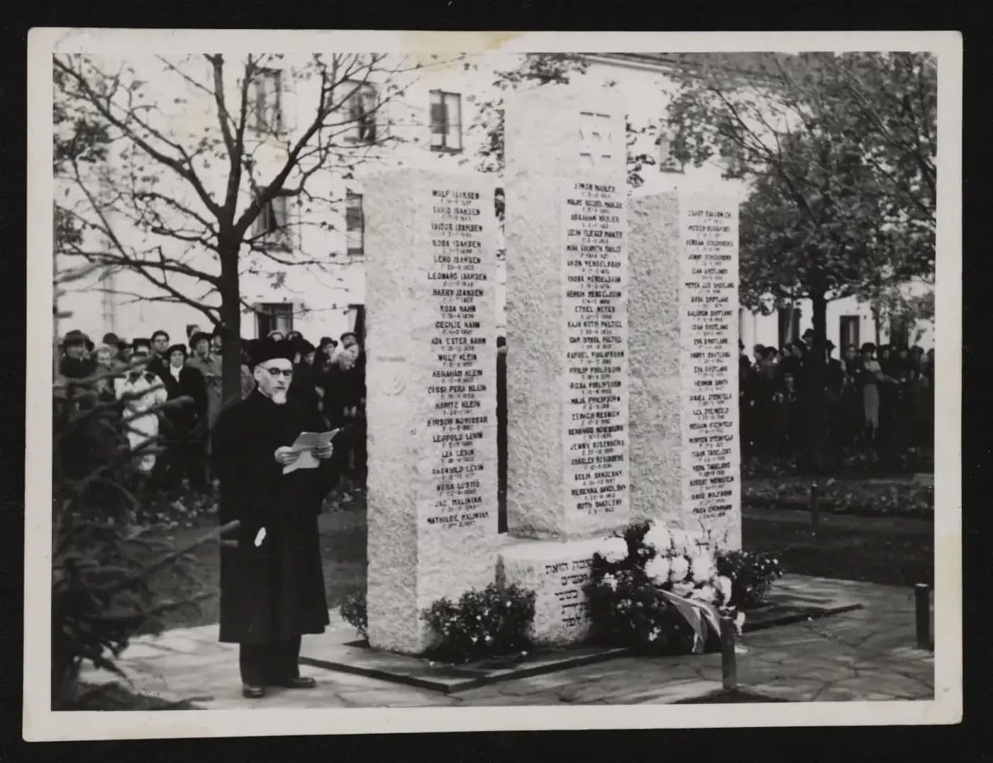 Rabbi Jacobson stands next to the monument in Trondheim, 1947.  (photo credit: YAD VASHEM)