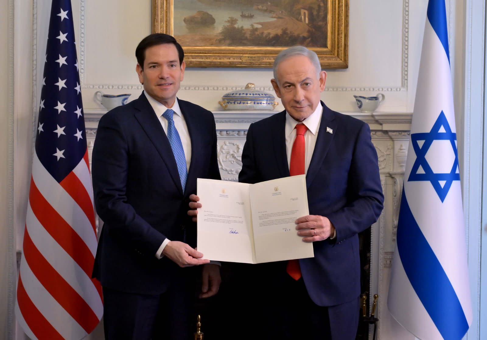 Prime Minister Benjamin Netanyahu and US Secretary of State Marco Rubio hold up the Gaza Board of Peace charter on Febuary 11, 2026.  (photo credit: Avi Ohayon/GPO)