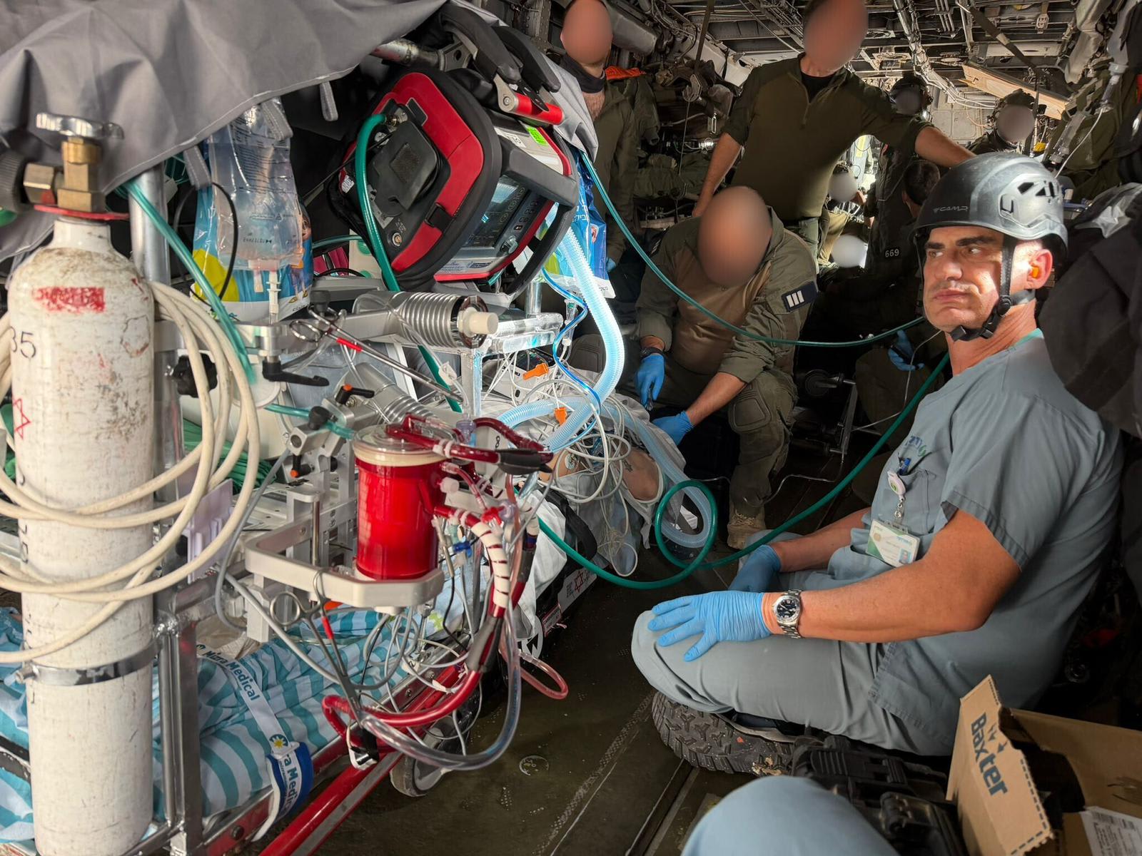 A military helicopter and medical staff from Soroka and Joseftal hospitals evacuate a patient connected to an ECMO machine, February 14, 2026. (photo credit: COURTESY SOROKA AND JOSEFTAL HOSPITALS)