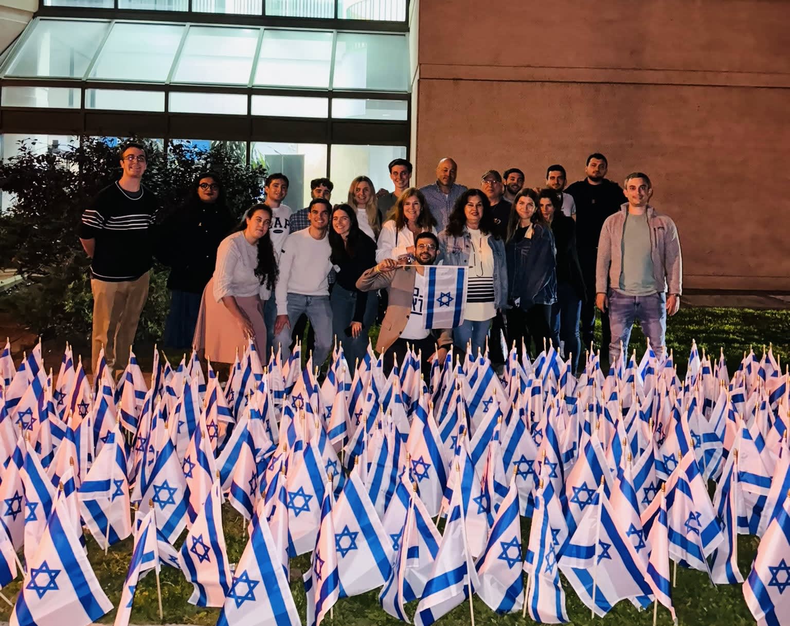 AVI STUDENTS and stakeholders join for a flag-planting ceremony outside AVI headquarters in October 2024.  (photo credit: Courtesy)