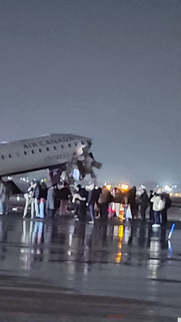 The aftermath of an Air Canada plane colliding with a fire truck at New York