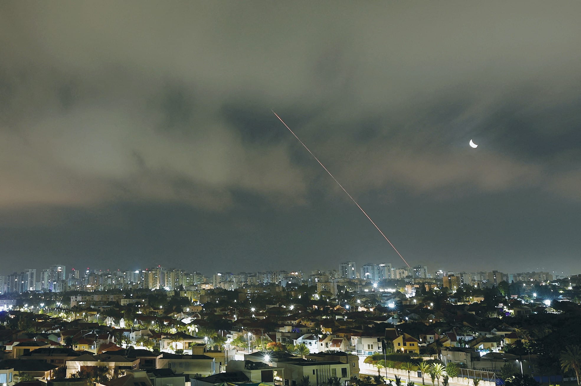  A missile launched from Iran is intercepted as seen from Ashkelon, last month. While Tehran bet on quantitative intimidation, Israel’s defense establishment built on qualitative efficiency, says the writer. (photo credit: AMIR COHEN/REUTERS)