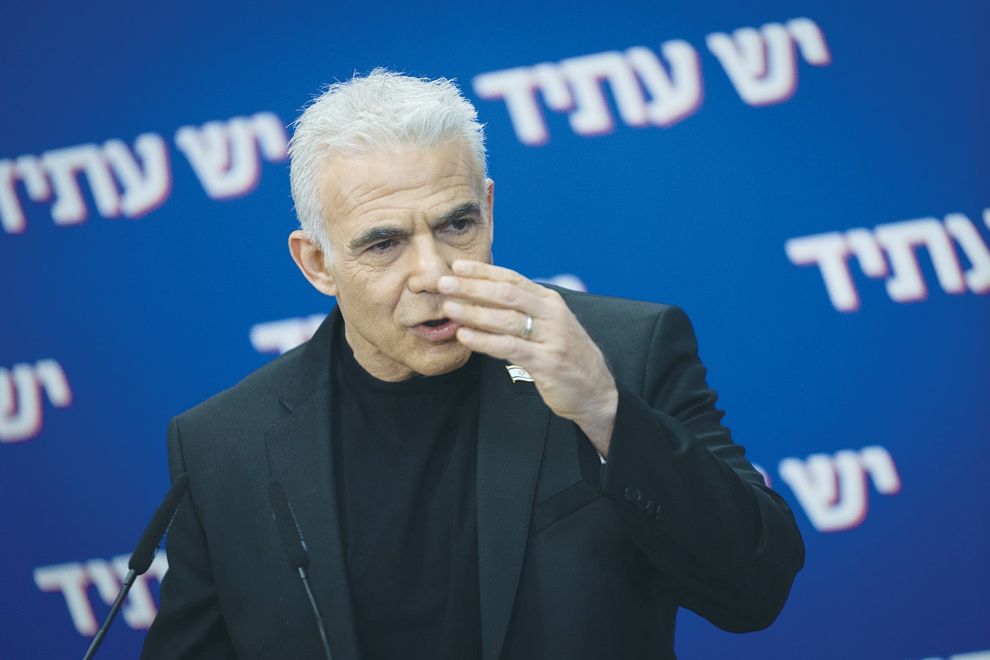 Yesh Atid leader MK Yair Lapid is seen at a faction meeting, last week. (photo credit: YONATAN SINDEL/FLASH90)