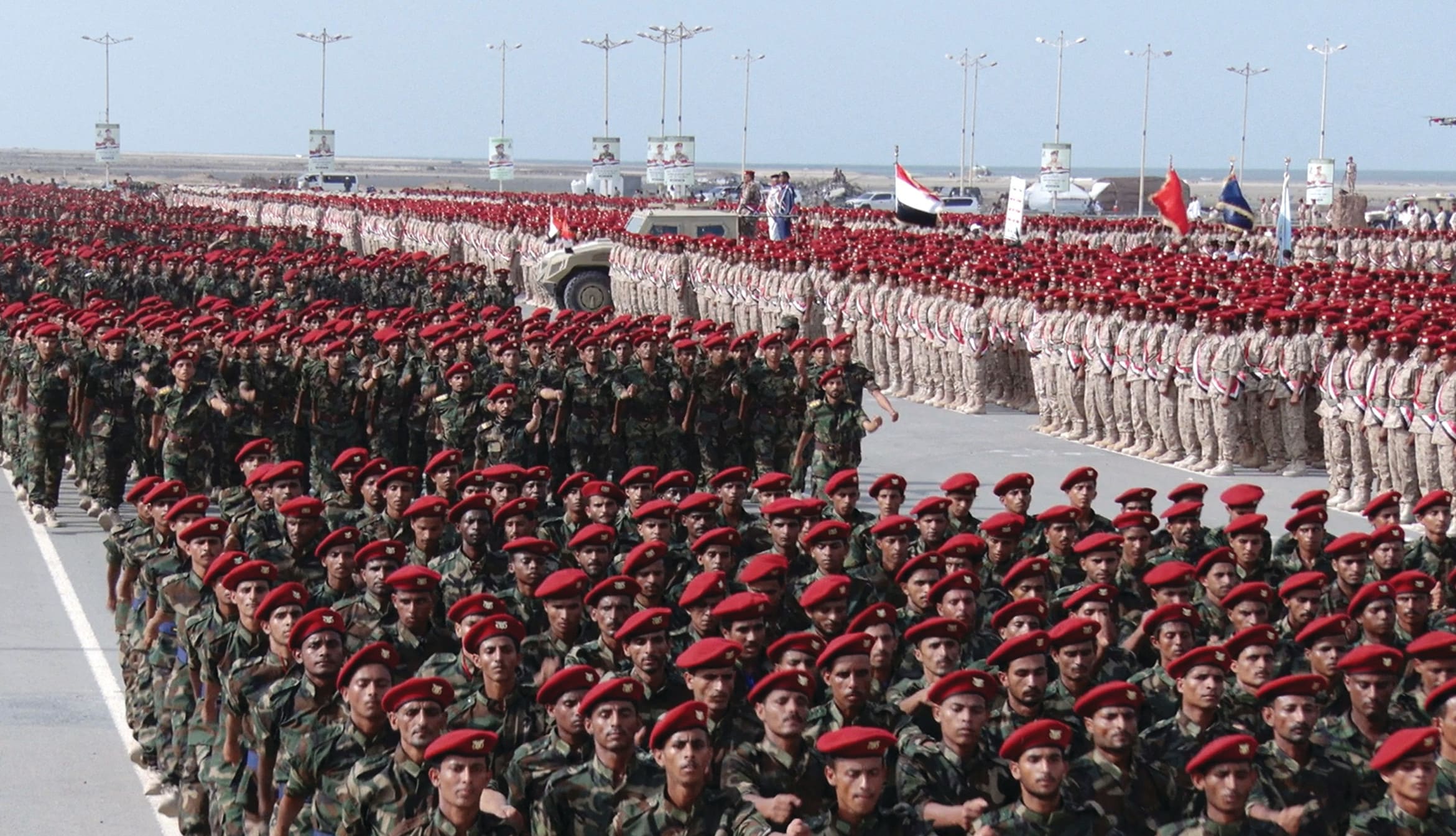 MEMBERS OF Houthi military forces parade in the Red Sea port city of Hodeidah, Yemen. Threatening to close the Bab al-Mandab Strait could end up strengthening Washington, the writer says. (photo credit: Houthi Military Media/Handout via REUTERS)