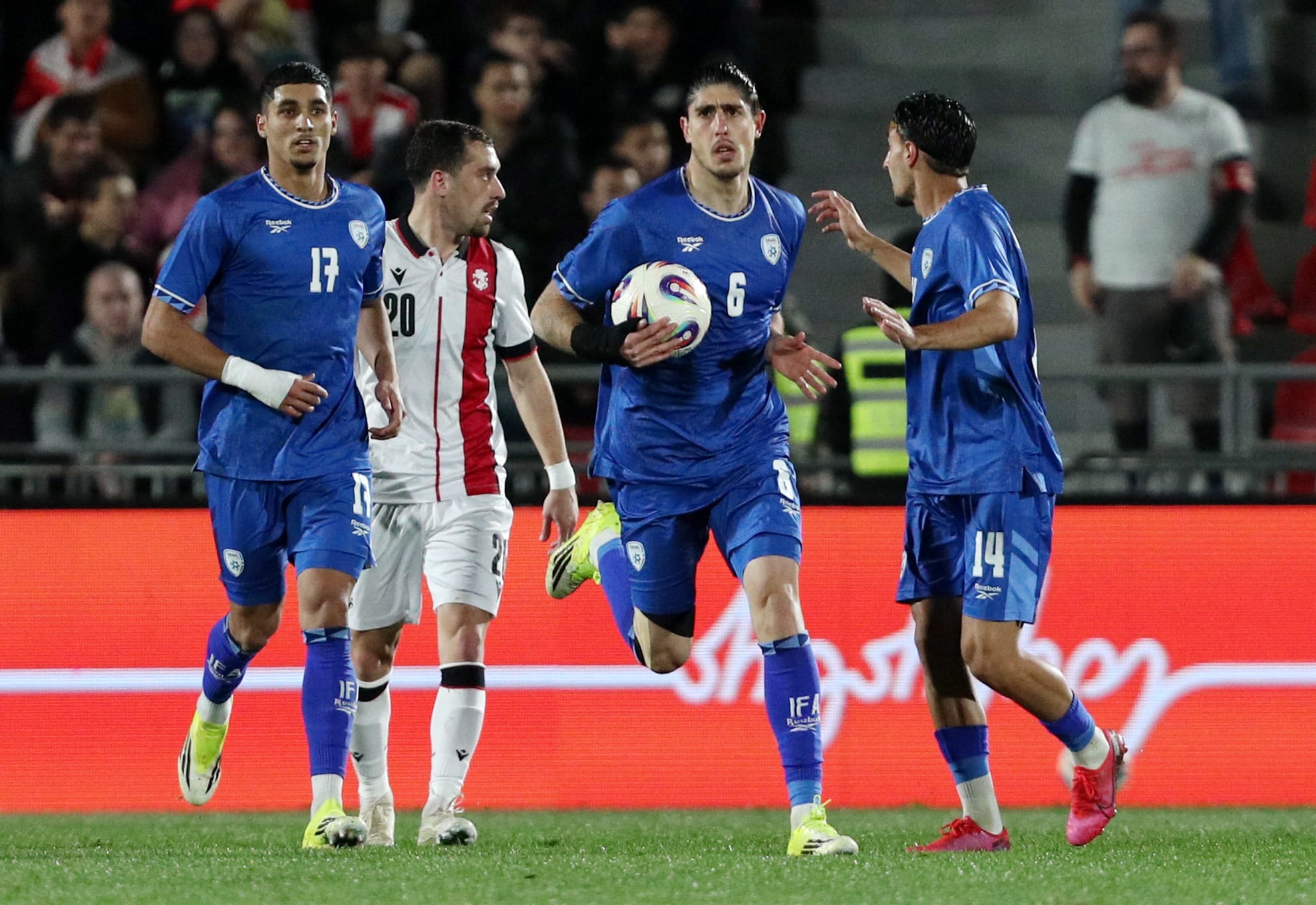 OMRI GANDELMAN (with ball) celebrates after scoring the equalizing goal in Israel’s 2-2 friendly draw with Georgia in Tbilisi over the weekend. (photo credit: Irakli Gedenidze/Reuters)
