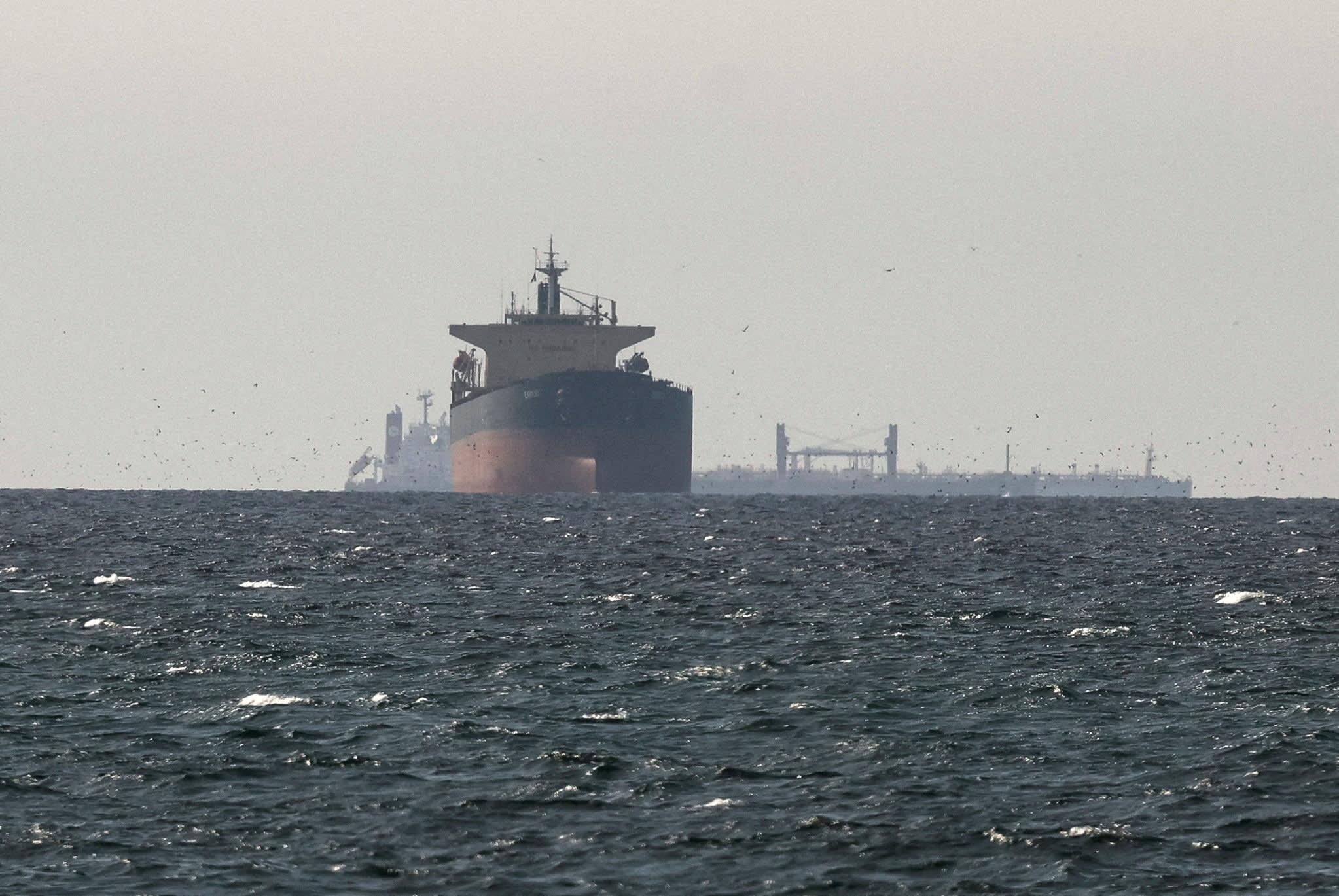 Tankers sail in the Gulf, near the Strait of Hormuz, as seen from northern Ras al-Khaimah, near the border with Oman’s Musandam governance, amid the US-Israeli conflict with Iran, in United Arab Emirates, March 11, 2026.  (photo credit: REUTERS/STRINGER)