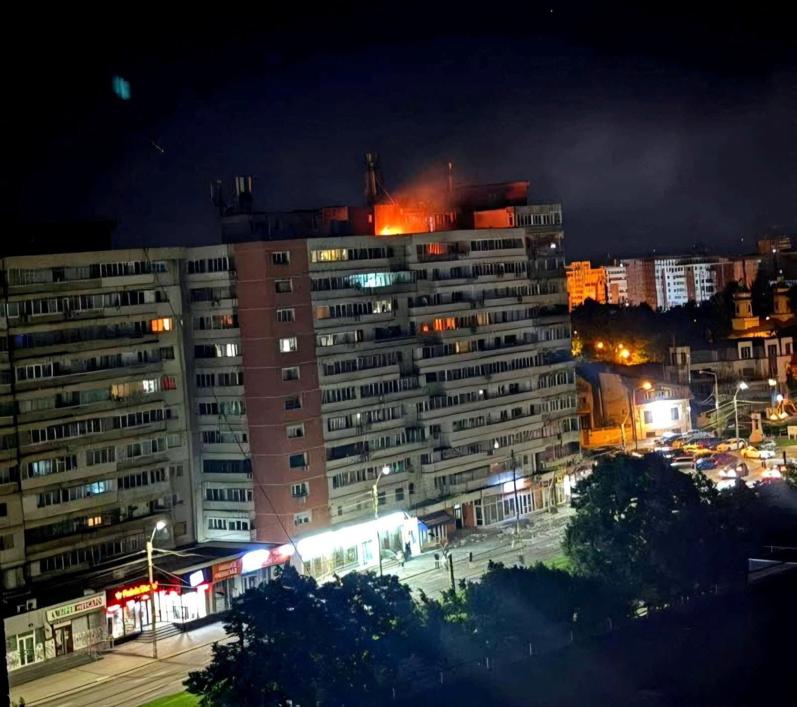 A fire burns on the roof of a 10-story block of flats after a drone crashed into the building, causing an explosion and injuring two people, near the border with Ukraine, in Galati, Romania, in this handout image released on May 29, 2026. (photo credit: Romanian Department for Emergency Situations (DSU)/Handout via REUTERS)