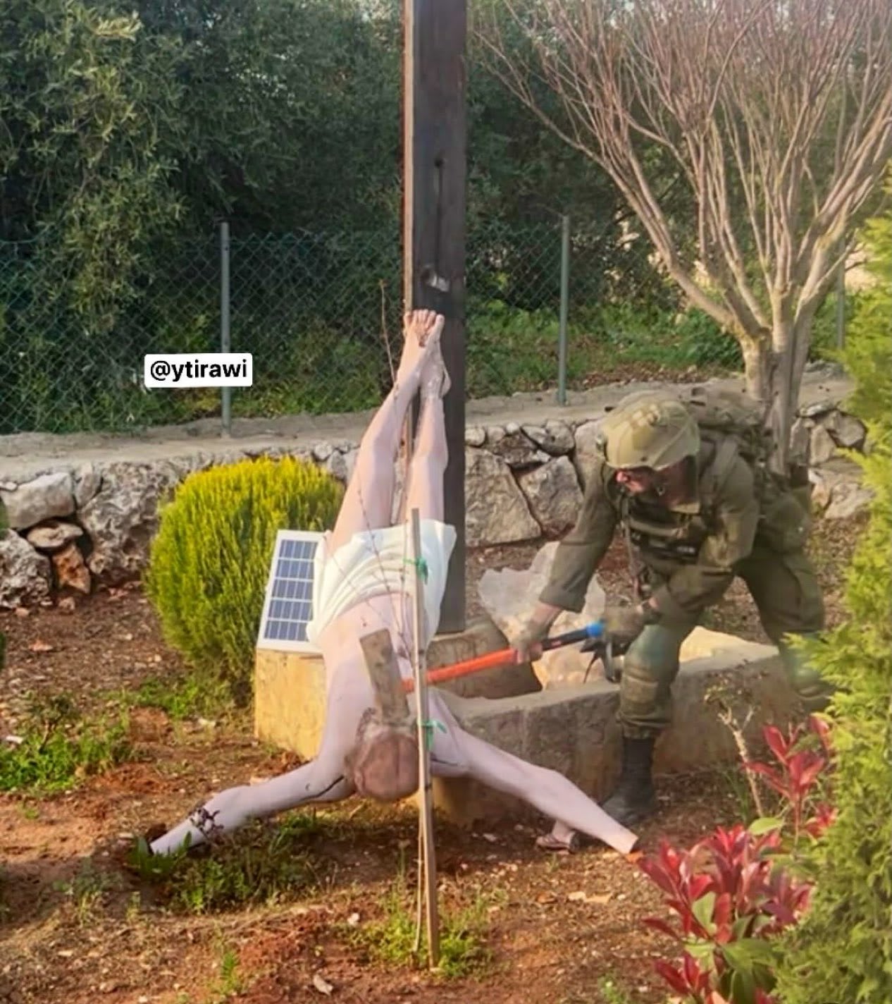 This X/Twitter screenshot shows an alleged incident where an IDF soldier is seen smashing a statue of Jesus in southern Lebanon on April 19, 2026. (photo credit: SCREENSHOT/X)