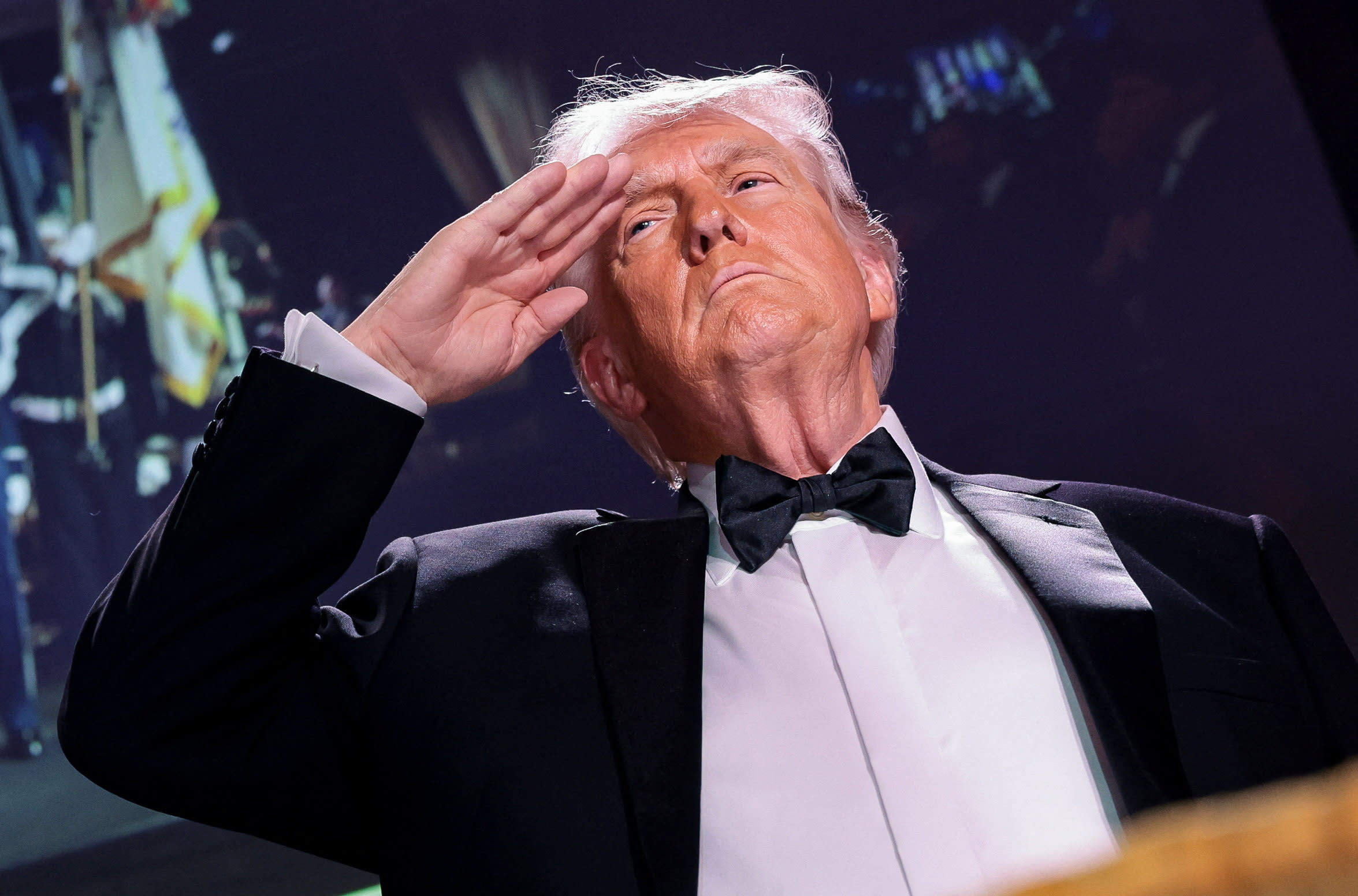 US President Donald Trump salutes during the annual White House Correspondents