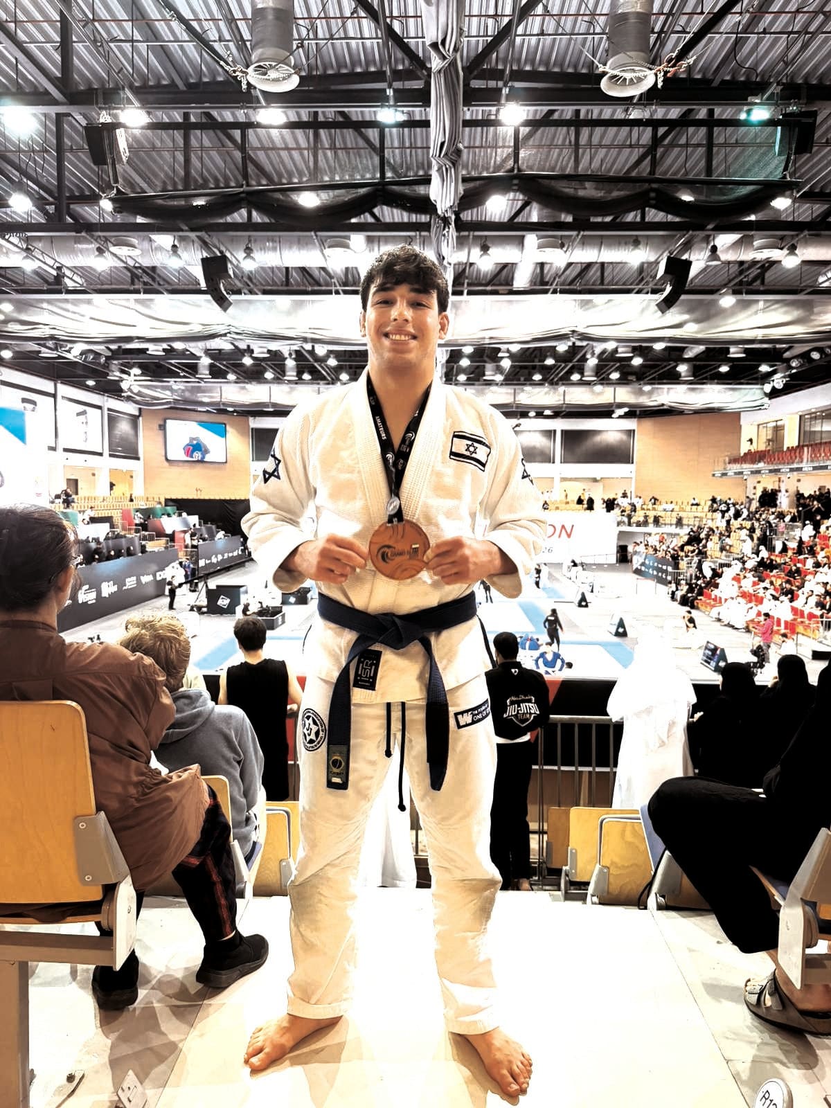 Despite tense podium incident, Israeli fighter Yoav Manor wins bronze in Abu...
